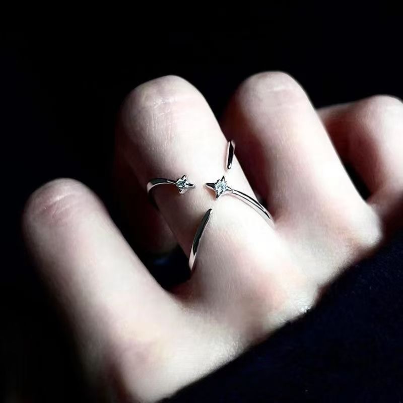 Diamond-encrusted four-pointed star ring