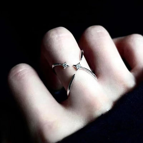 Diamond-encrusted four-pointed star ring