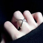 Diamond-encrusted four-pointed star ring